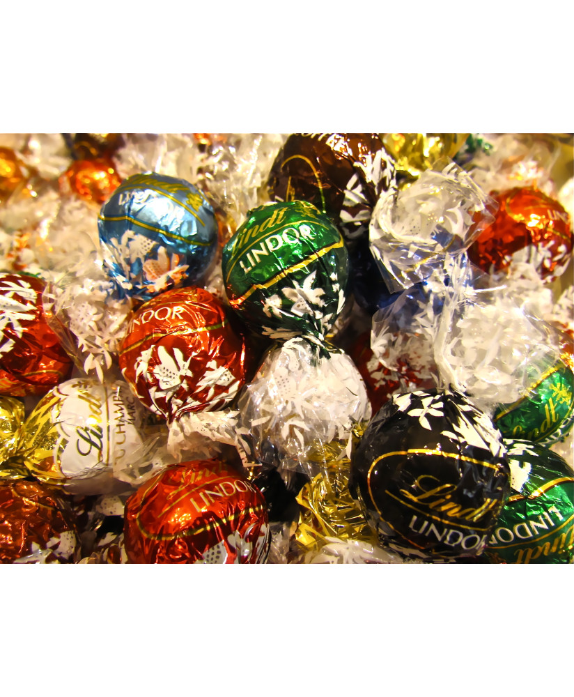 Vendita online cioccolatini Lindor di Lindt e Sprüngli, assortiti, ripieni a vari gusti. Shop on-line cioccolatino Lindor rosso.